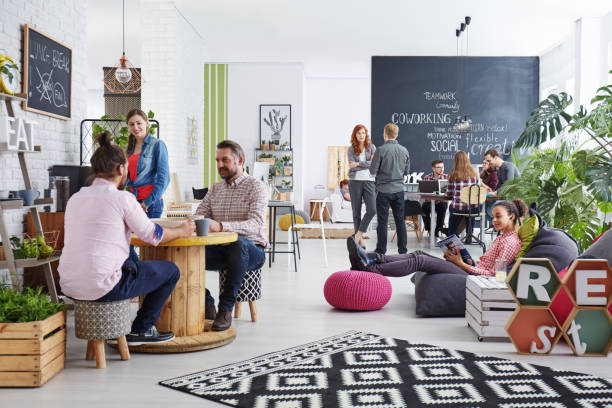 People working in modern agency relaxing during lunch break